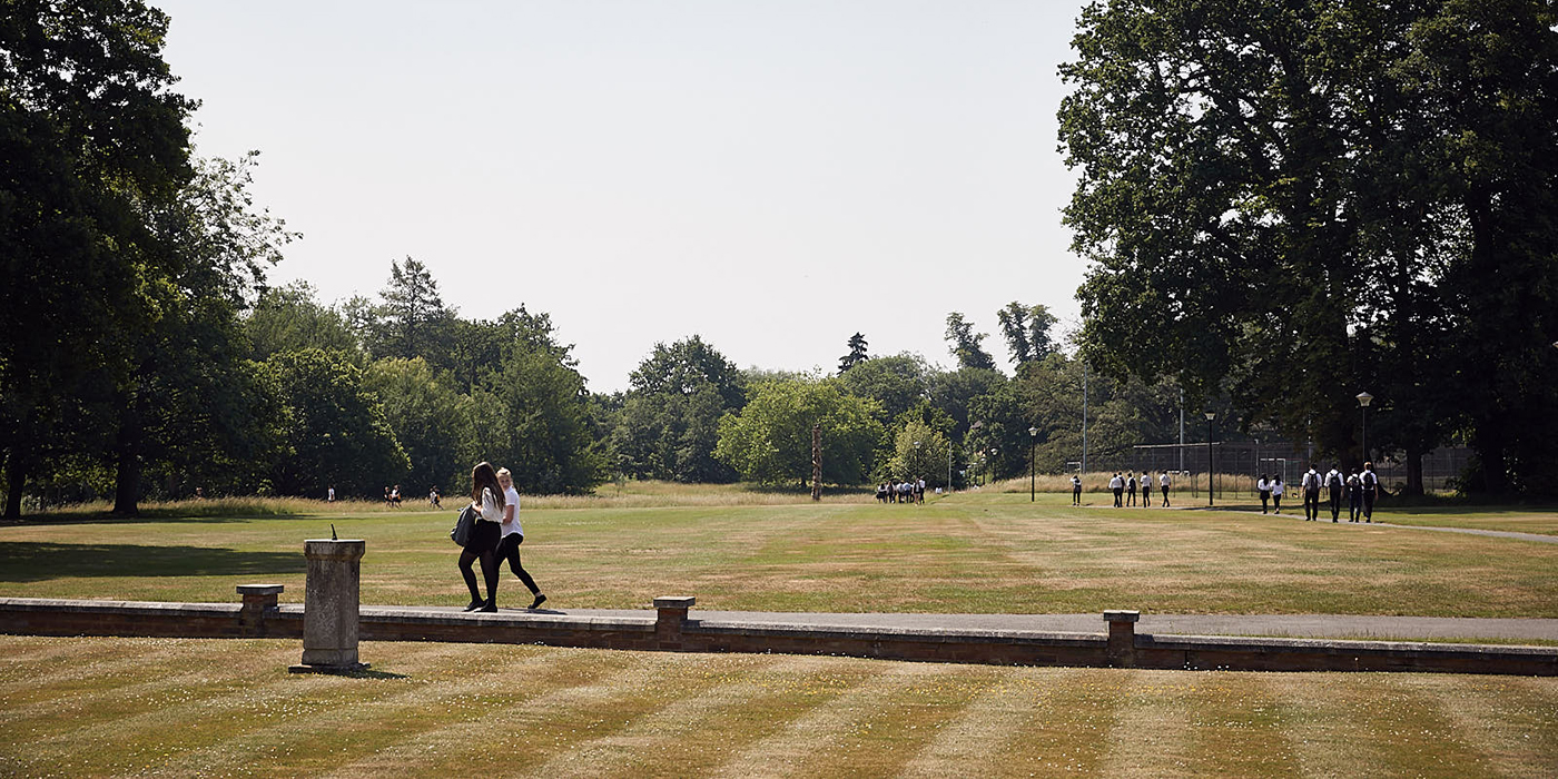 Girls crossing the park