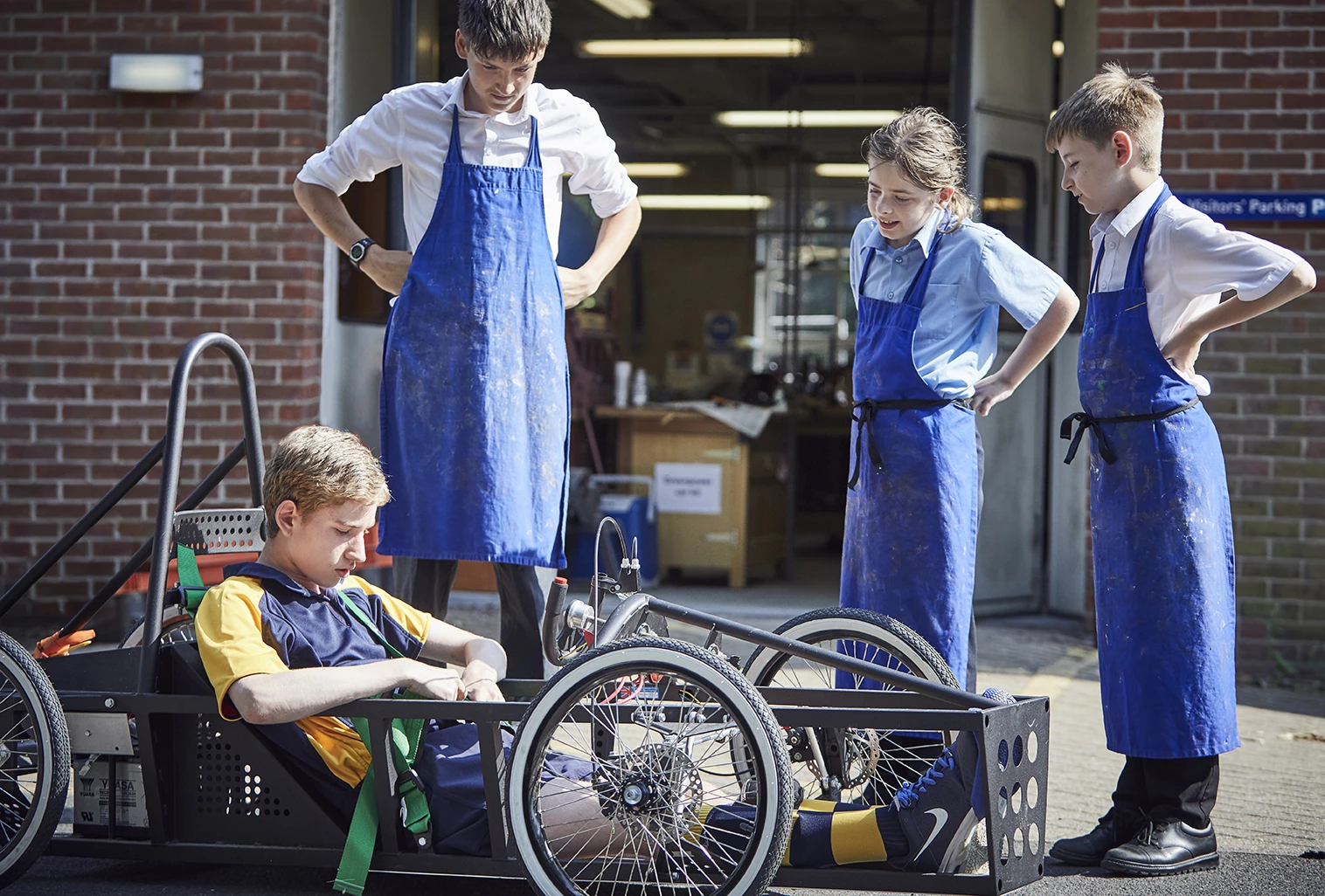 Students checking the kart they created