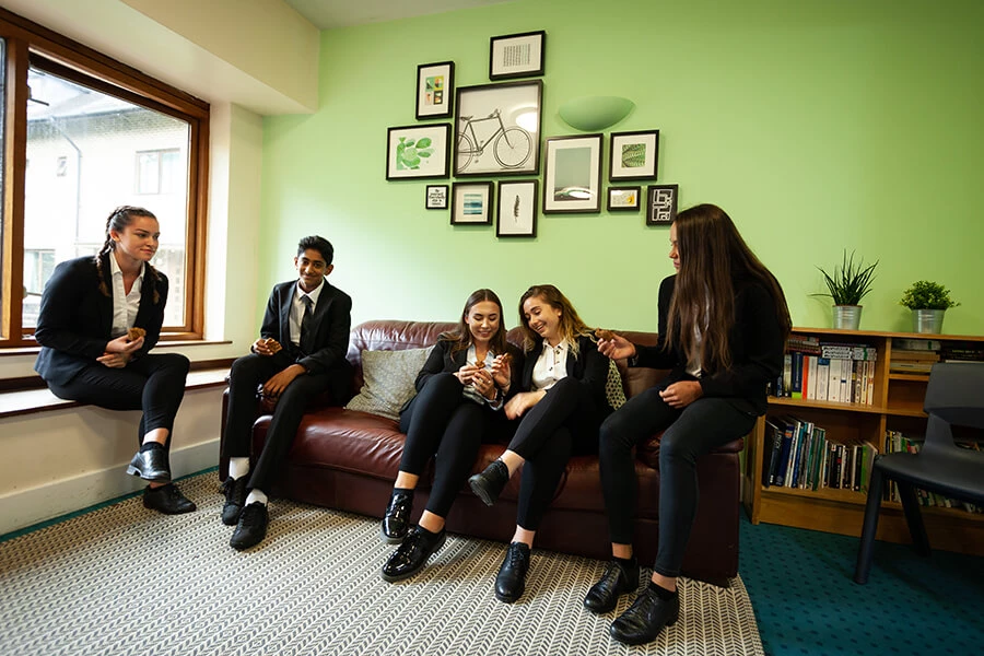 Students seating on sofa and relaxing