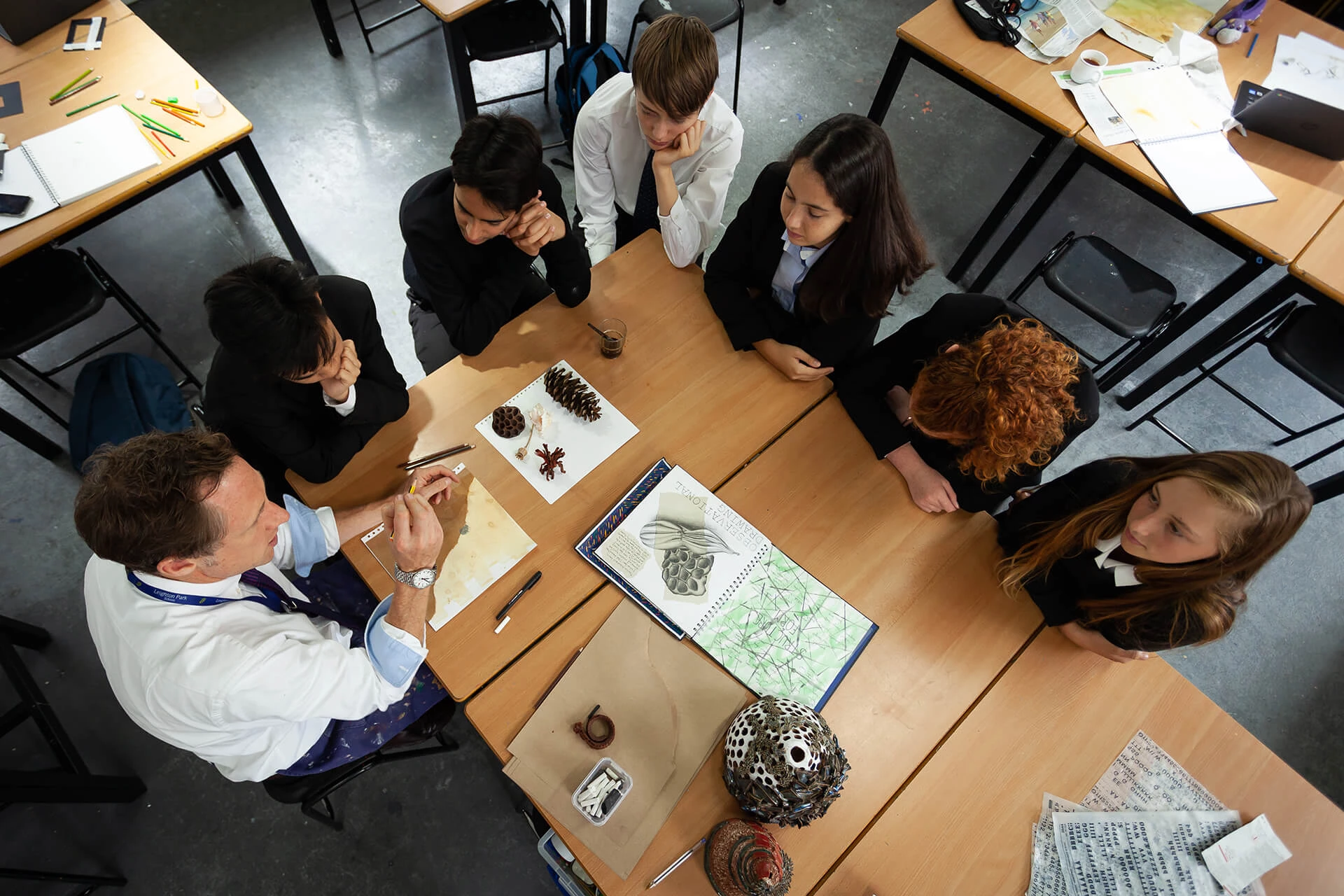 Art class aerial view of students with teacher