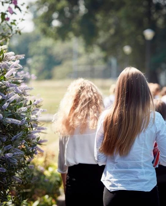 Girls walking between classes