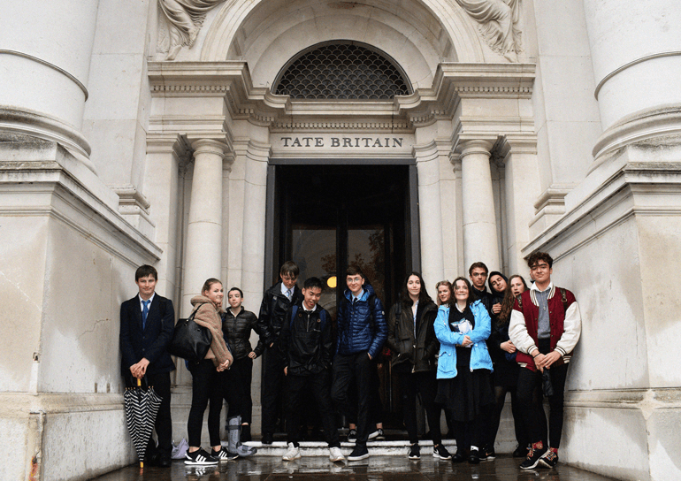 Group of pupils standing outside of Tate Modern entrance