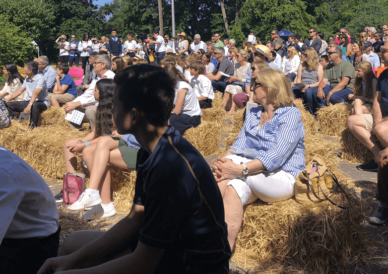 Fryer parents sitting on straw bales