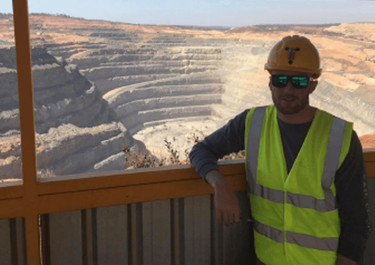 Old Leightonian Tom Lee standing in front of Australian Gold mine