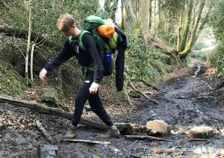Leighton boy on Duke of Edinburgh course walking up muddy path