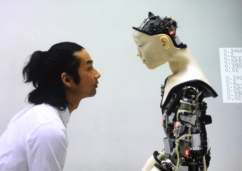 Man staring into the eyes of a robot