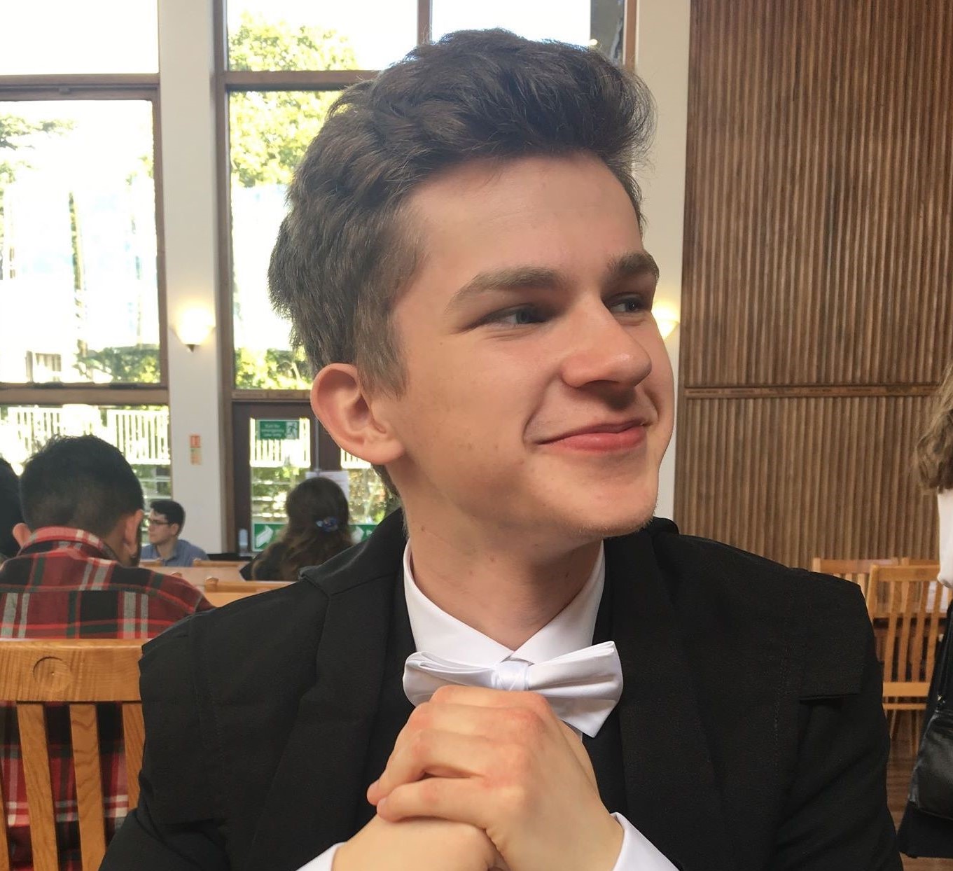 picture of Nat looking smart in a bow tie & suit
