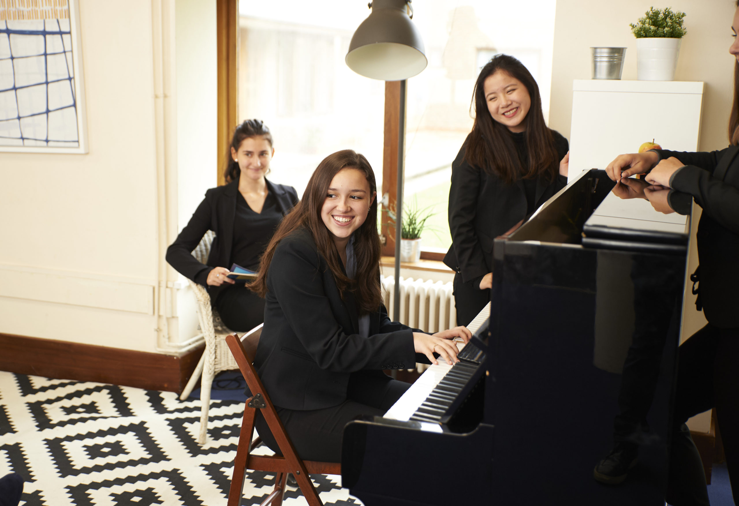 Girls around the piano