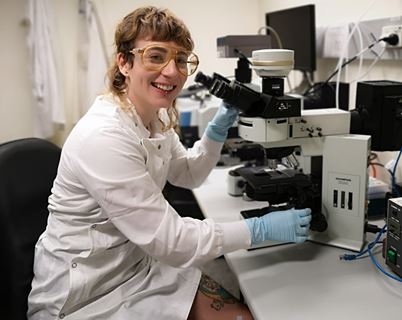 Old Leightonian Torie Foster with microscope