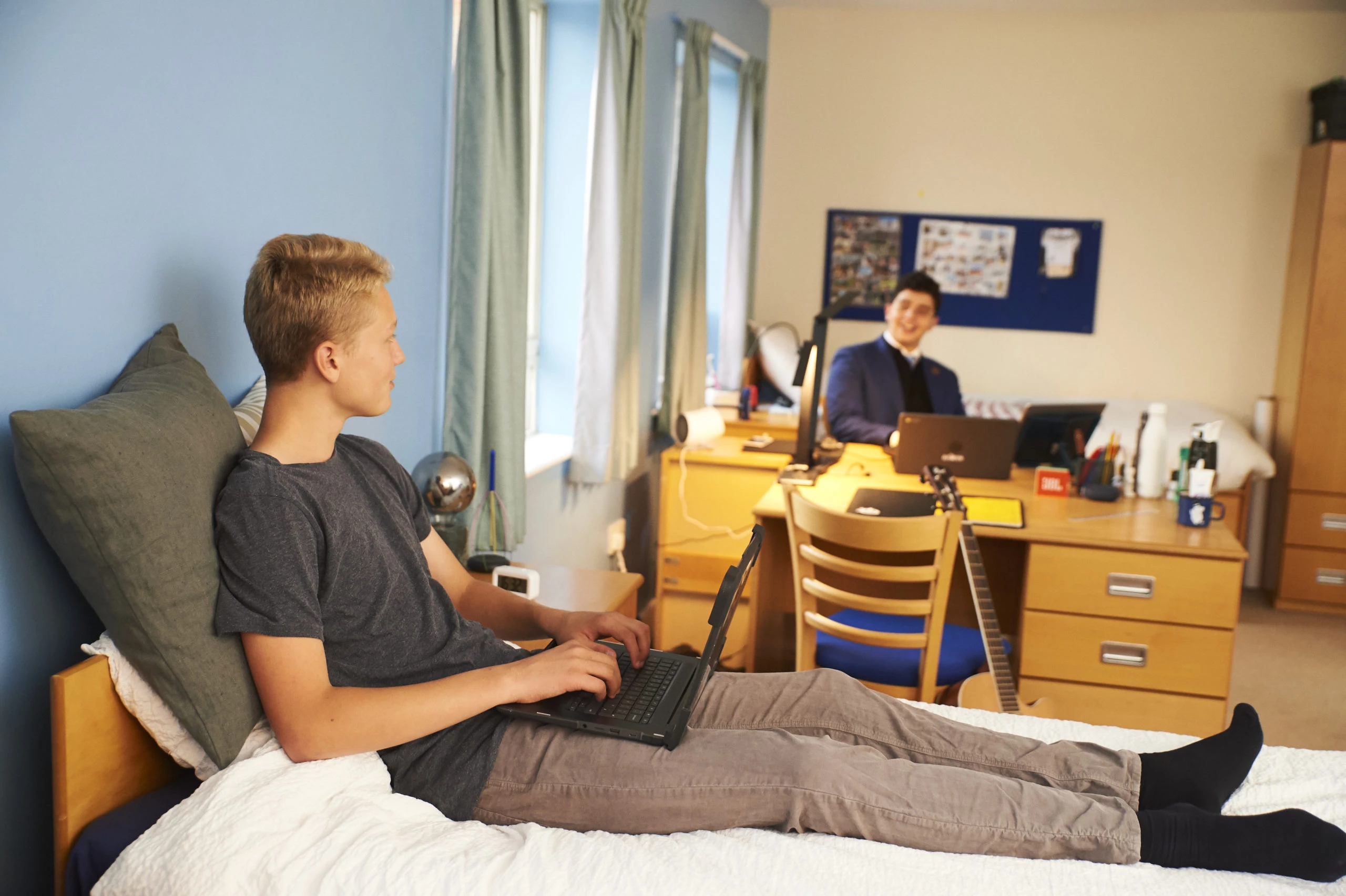 Boys sat in room talking