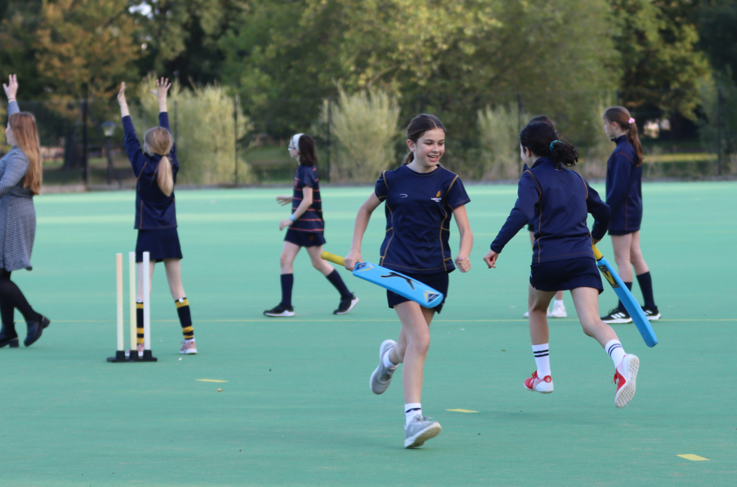 Leighton Park girls playing cricket
