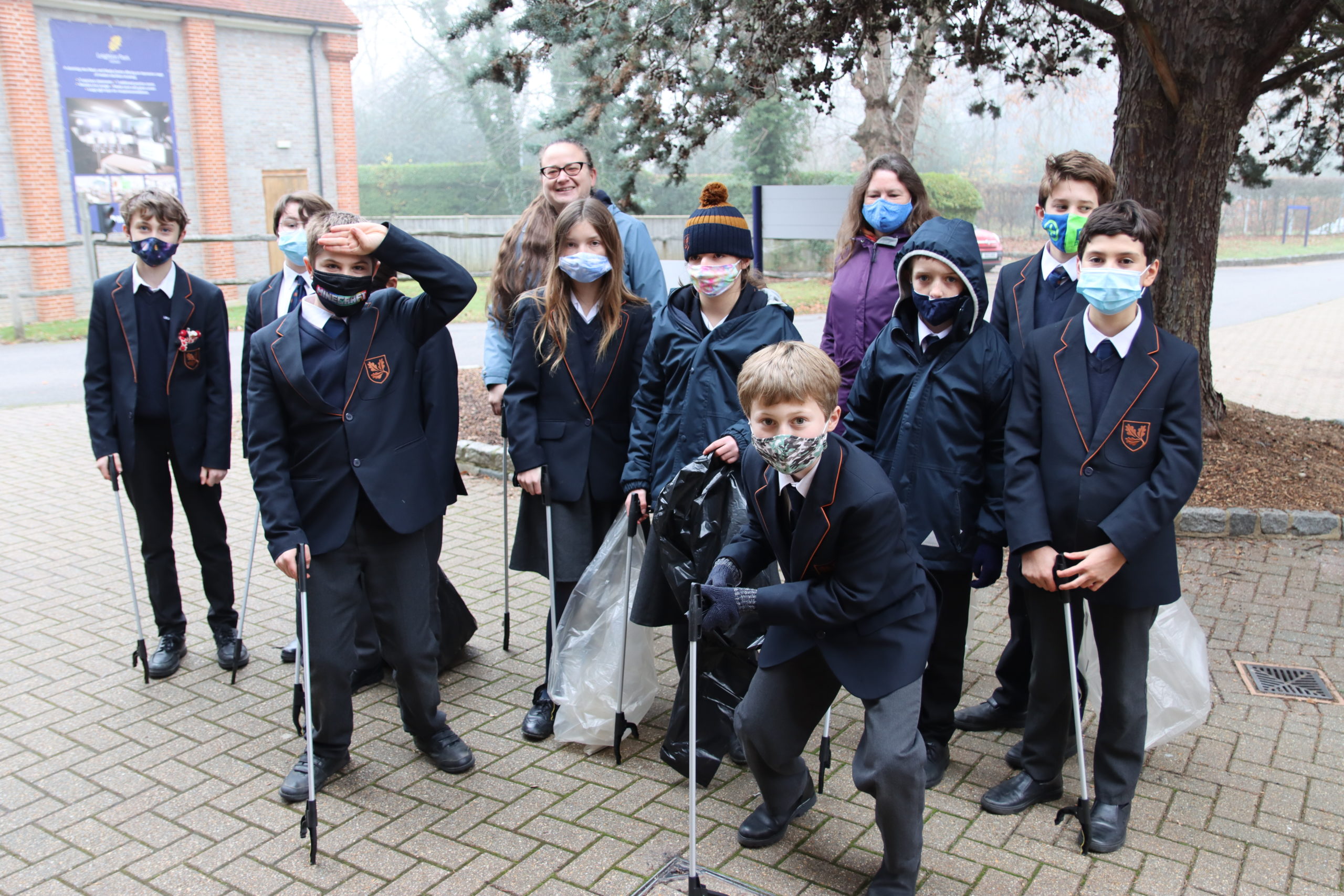 students picking up litter