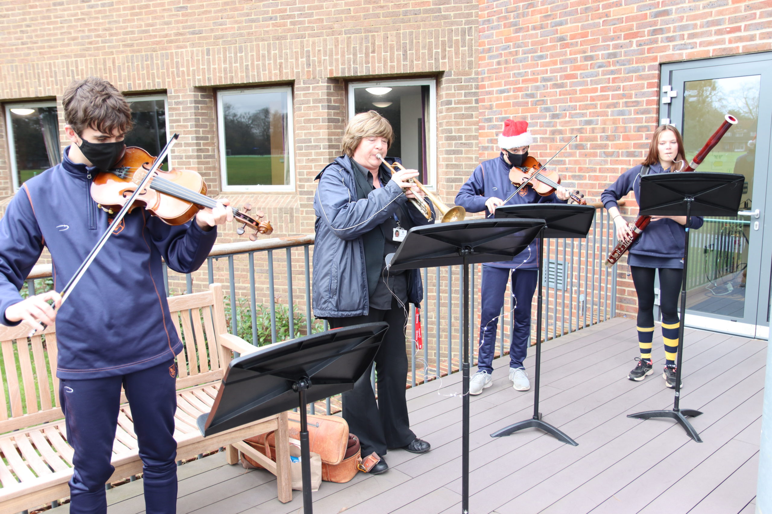 Orchestra performing on the terrace of the Michael Malnick Centre