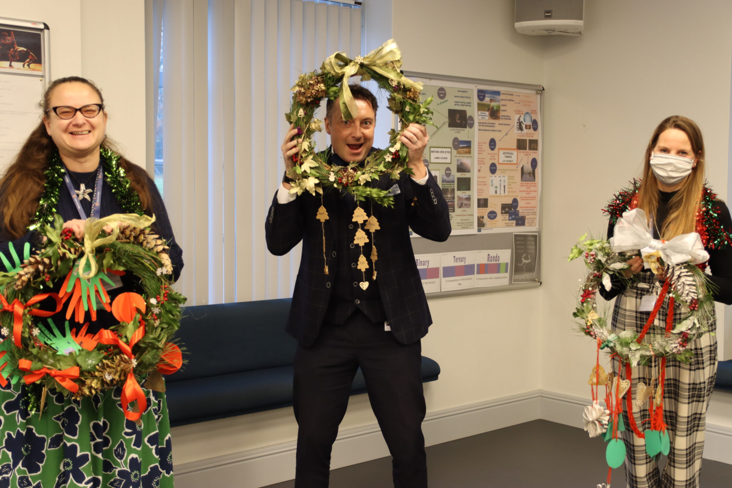 Prefects and Eco School winners holding their winter wreaths