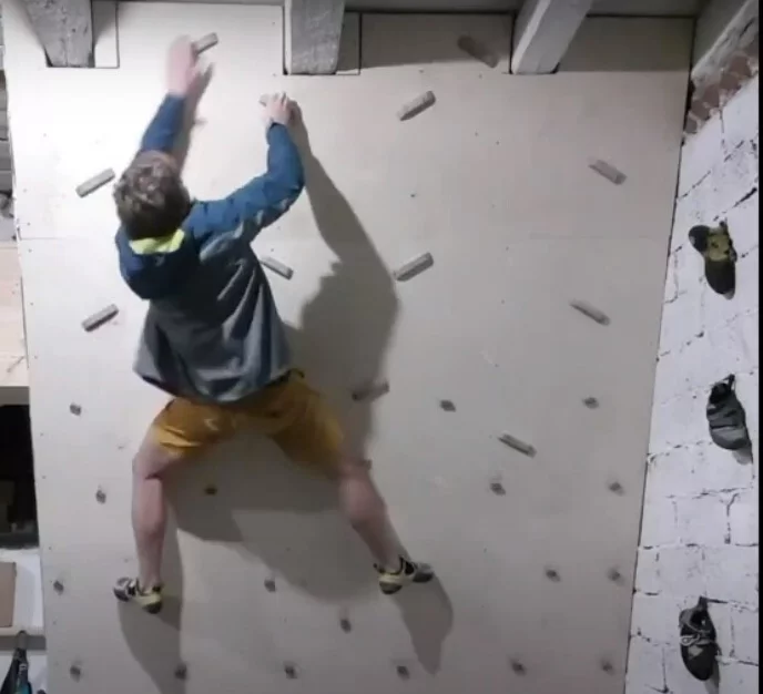 Johnnie in the Upper Sixth on the climbing wall he built in his home