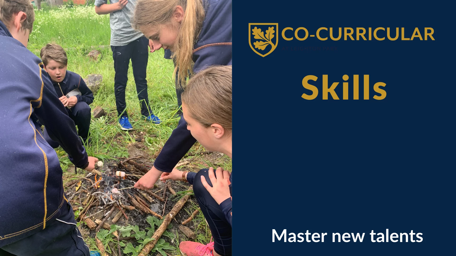 Students toasting marshmallows over fire they've built