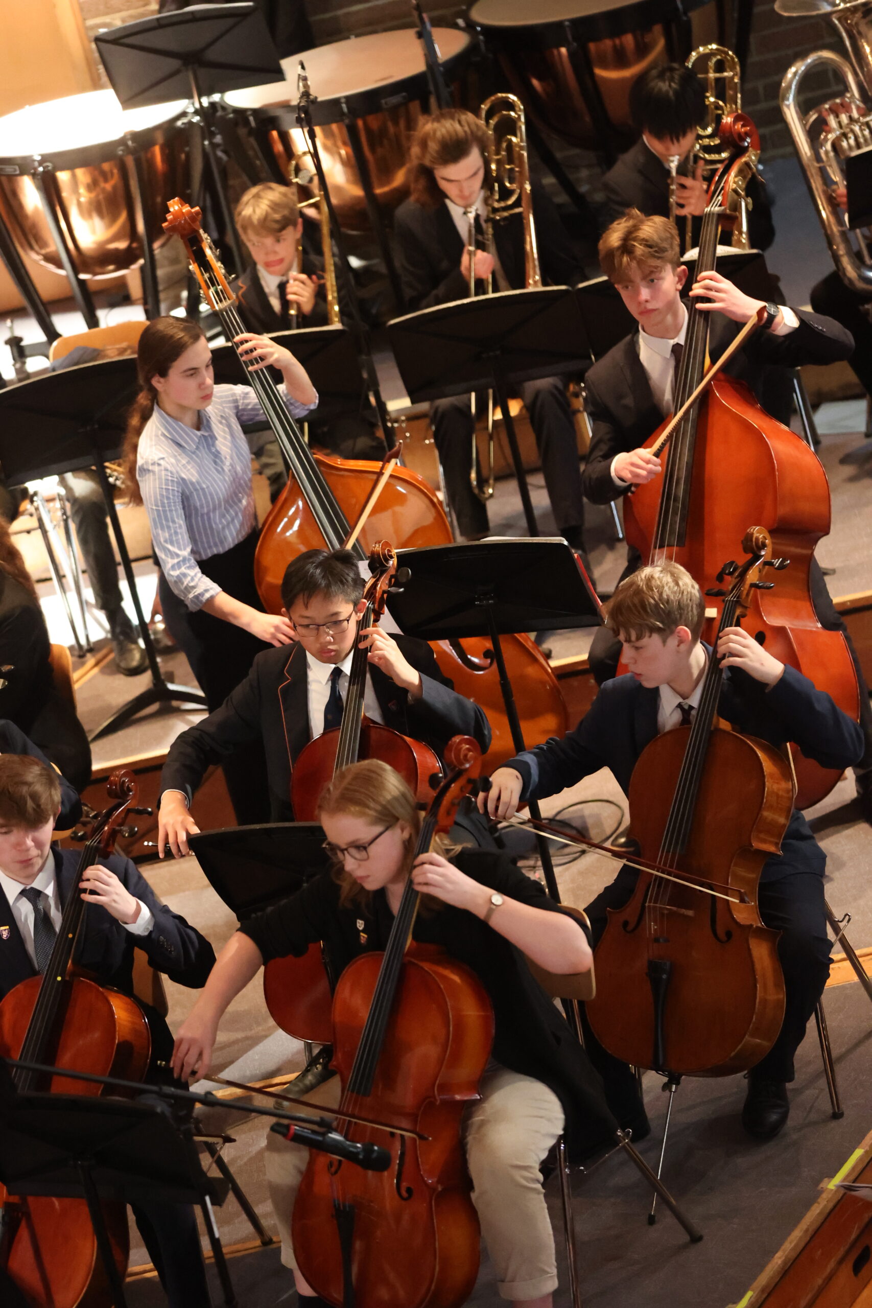 Students playing string instruments