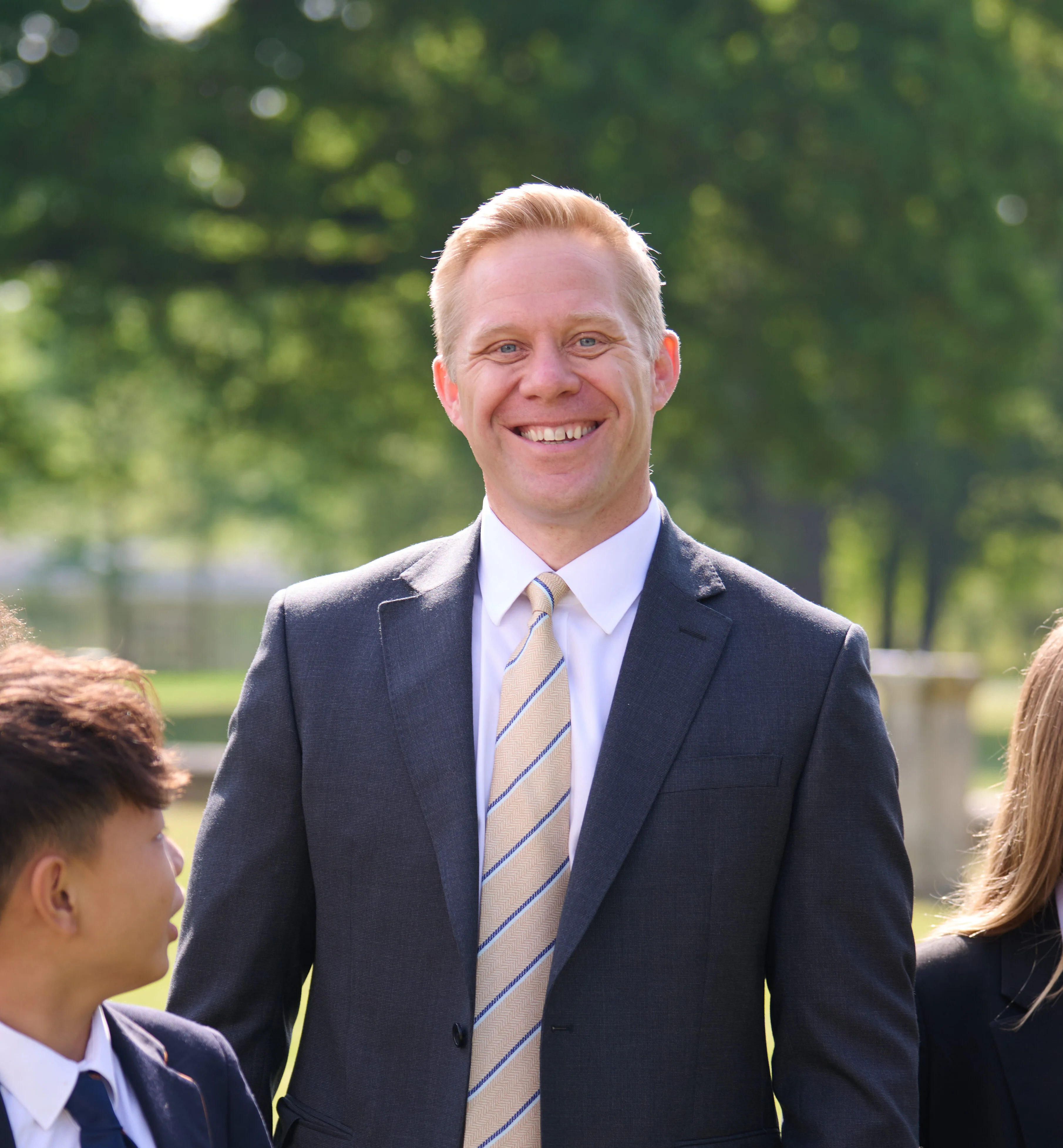 Luke with students